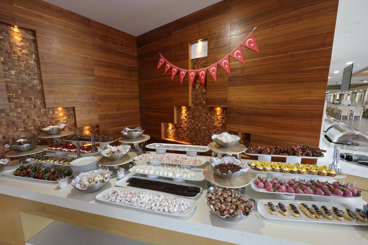 Отель Ramada Hotel & Suites By Wyndham Kusadasi